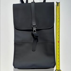 Rains Black Backpack with Minimalist Design and Durable Material